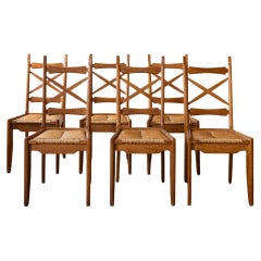 Set of Six Guillerme 
Chambron Dining Chairs in Oak and Rush, 1950s