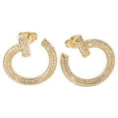 Tiffany & Co. Orecchini a cerchio aperti in oro giallo con diamante Tiffany T1