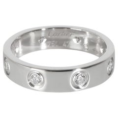 Bague Love en or blanc à diamants et petit modèle de Cartier