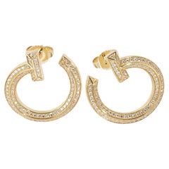 Tiffany & Co. Orecchini a cerchio aperti in oro giallo con diamante Tiffany T1