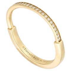 Anello con chiusura Tiffany & Co. in oro giallo e diamanti, misura 62