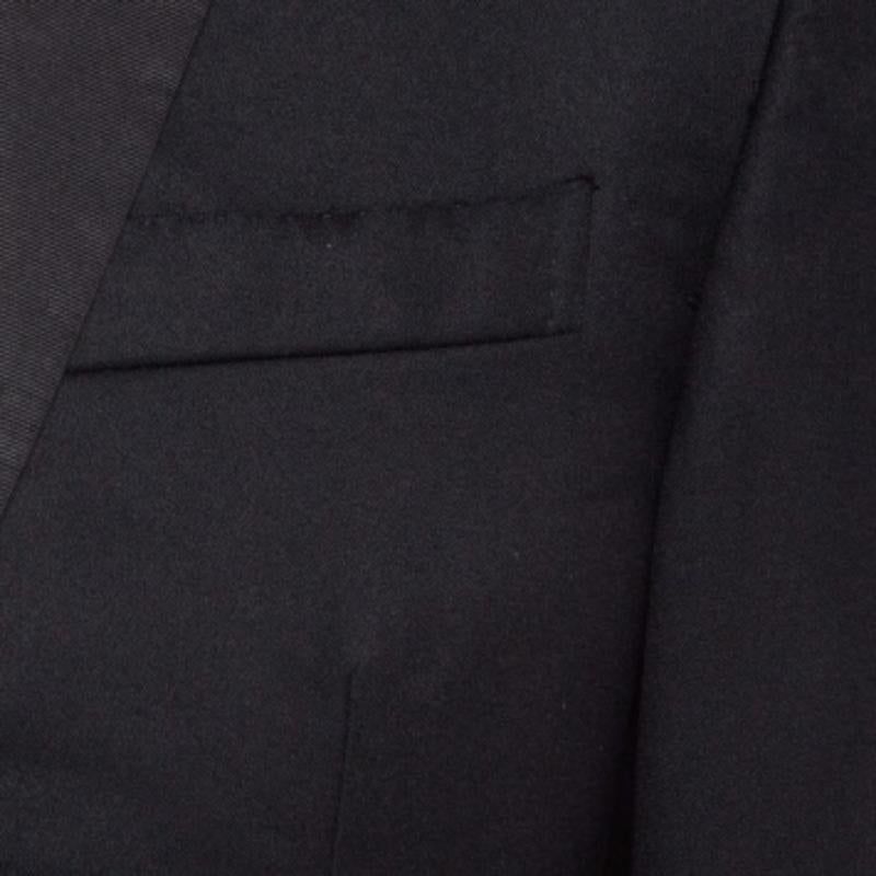 Dai un tocco di classe al tuo look con questo tailleur pantalone di Zegna. Realizzato con cura utilizzando la lana, l'abito nero rimarrà un punto fermo del guardaroba.