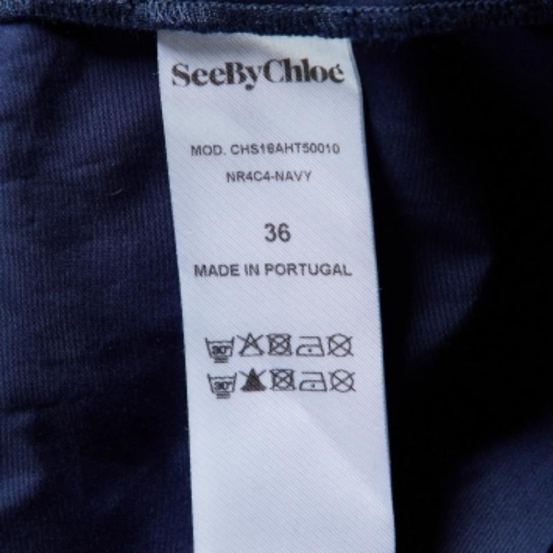 See By Chloe Top con mangas acampanadas y ribete de encaje de algodón azul S en venta 1