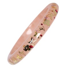 Pulsera tipo brazalete de Louis Vuitton en esmalte rosa con latón y pedrería