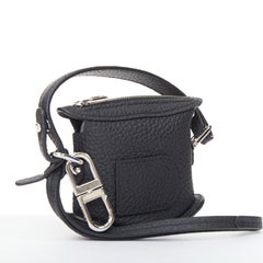 DELVAUX Pin Mini Bucket black taurillon soft leather silver hardware bag charm