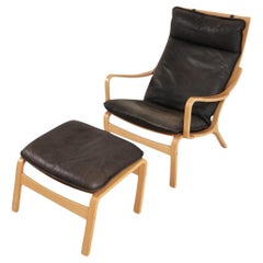 Danish Modern lounge chair and ottoman in bent beech wood and brown leather Danish Modern lounge chair and ottoman in bent beech wood and brown leather