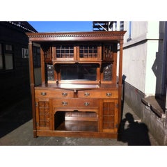 Antique Liberty & Co attr Arts & Crafts oak sideboard with Stylized Copper Floral Panels