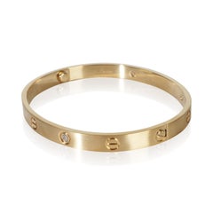 Bracciale Love Cartier in oro giallo con diamanti e finitura spazzolata
