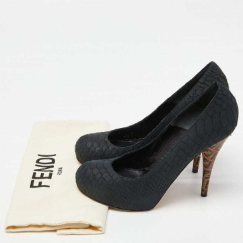 Made by Fendi, this pair of pumps is the perfect mix of comfort and style. Amp up your style quotient by wearing this pair of patent python-embossed pumps. This pair of brown pumps is complete with signature FF logo detailed stiletto heels.