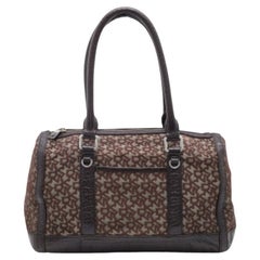 DKNY, la borsa in tela e pelle marrone scuro firmata da DKNY