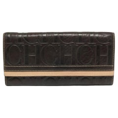 Portafoglio continentale in pelle goffrata Monogram marrone/beige CH Carolina Herrera