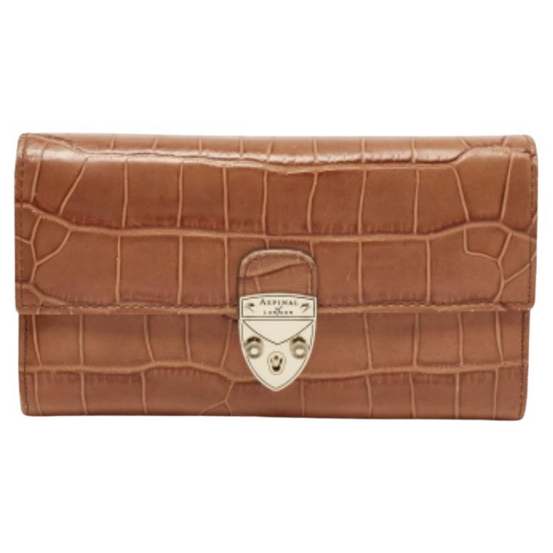 Aspinal of London Portafoglio continentale Mayfair in pelle marrone goffrata a coccodrillo in vendita