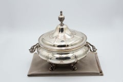Silver tureen with eight sections, floral reliefs 
acanthus feet