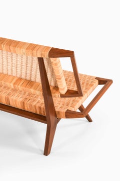 Mid Century Bench / Sofa in Mahogany and Cane by Paul László, 1950
