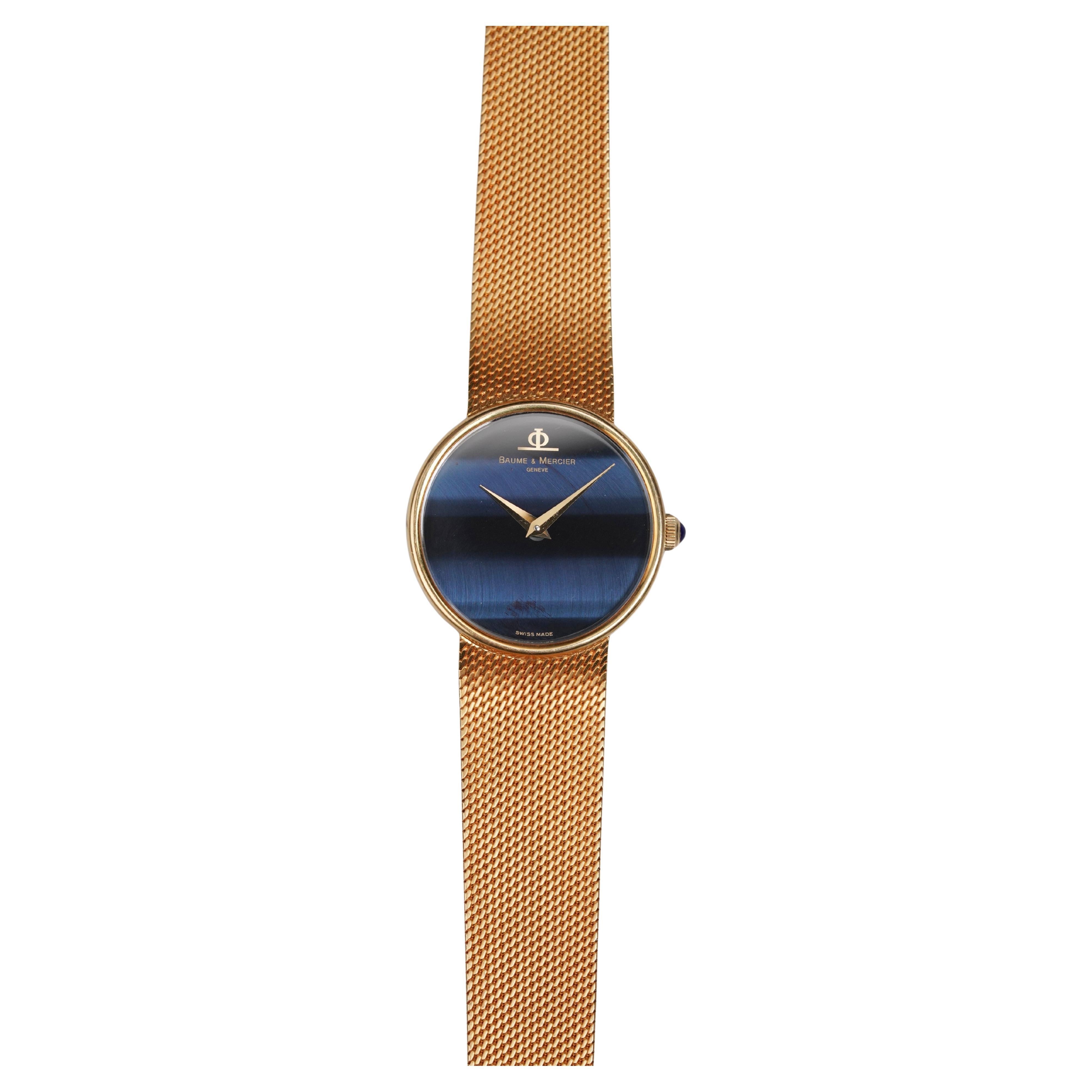 Montre Baume 
Mercier Blue Falcon Eye en or jaune 18 carats, années 1970 en vente