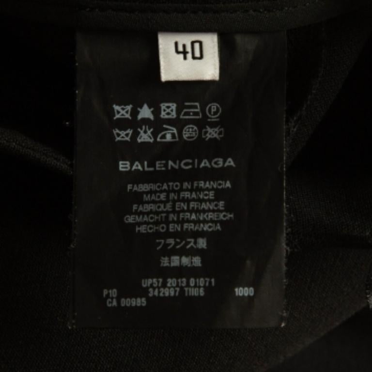 Balenciaga Pantalon en laine noir avec détails drapés M. Pour femmes en vente
