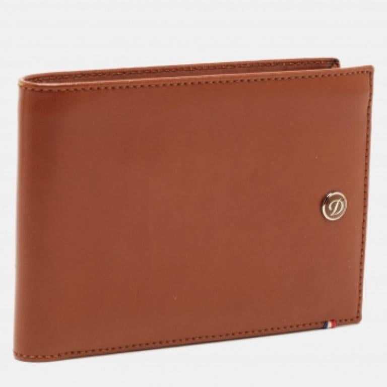 Ce S.T.T. Le portefeuille brun Dupont est pratique et d'un design sophistiqué. Créé à partir de matériaux luxueux, son intérieur compartimenté gardera votre argent et vos cartes en ordre.