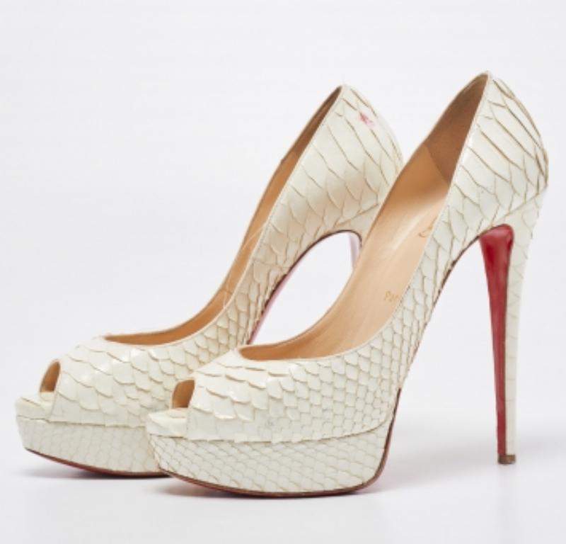 Stand out from the crowd with this luxurious pair of Louboutins that exude high fashion with class. Crafted from python leather, this is a creation from their Lady Peep collection. It features a white shade with peep toes and an architectural shape.