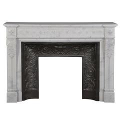 Antique Louis XVI style fireplace in Semi-Statuary marble with carved flowers