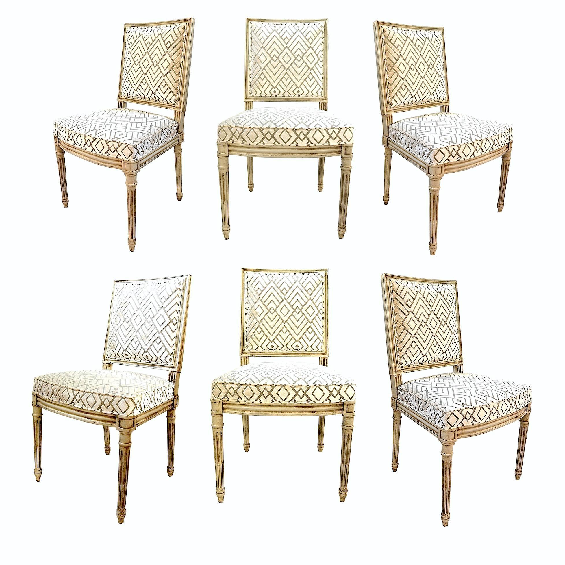 Set of six Louis XVI style dining chairs by Henredon that have been updated in a fantastic geometric cut-velvet. The look is luxe and clean. Classic French chair lines juxtaposed with a contemporary looking and feeling fabric choice. The set is