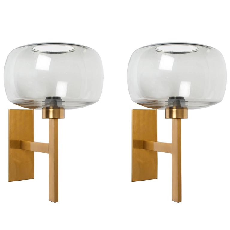 Pair of Scandinavian Modern brass sconces with gray glass shades. at 1stdibs