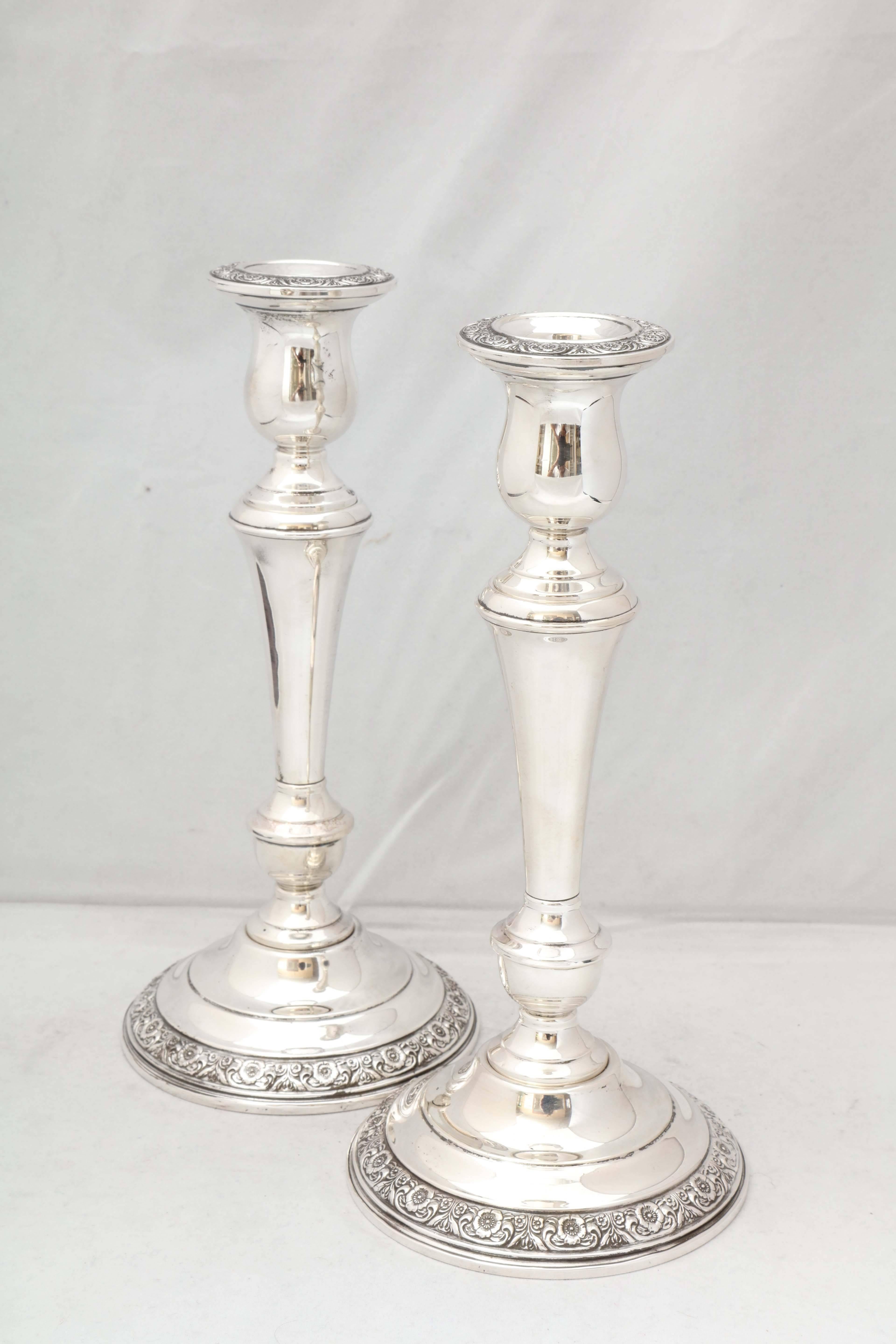 Pair of tall, sterling silver candlesticks in the 