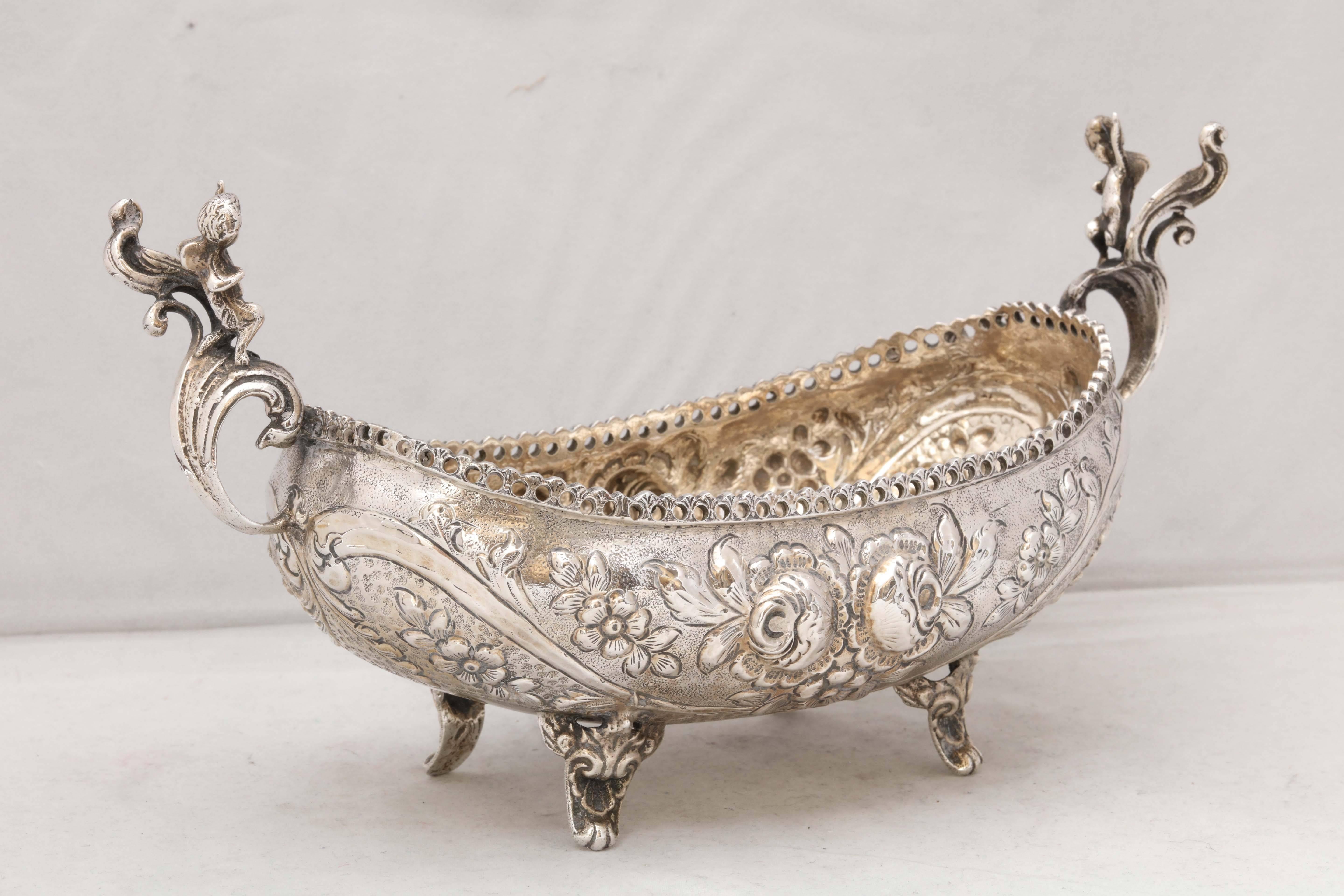 Victorian, 900 silver, footed centerpiece bowl, probably Madrid, circa 1890s. Decorated with blown out roses. Each handle is 