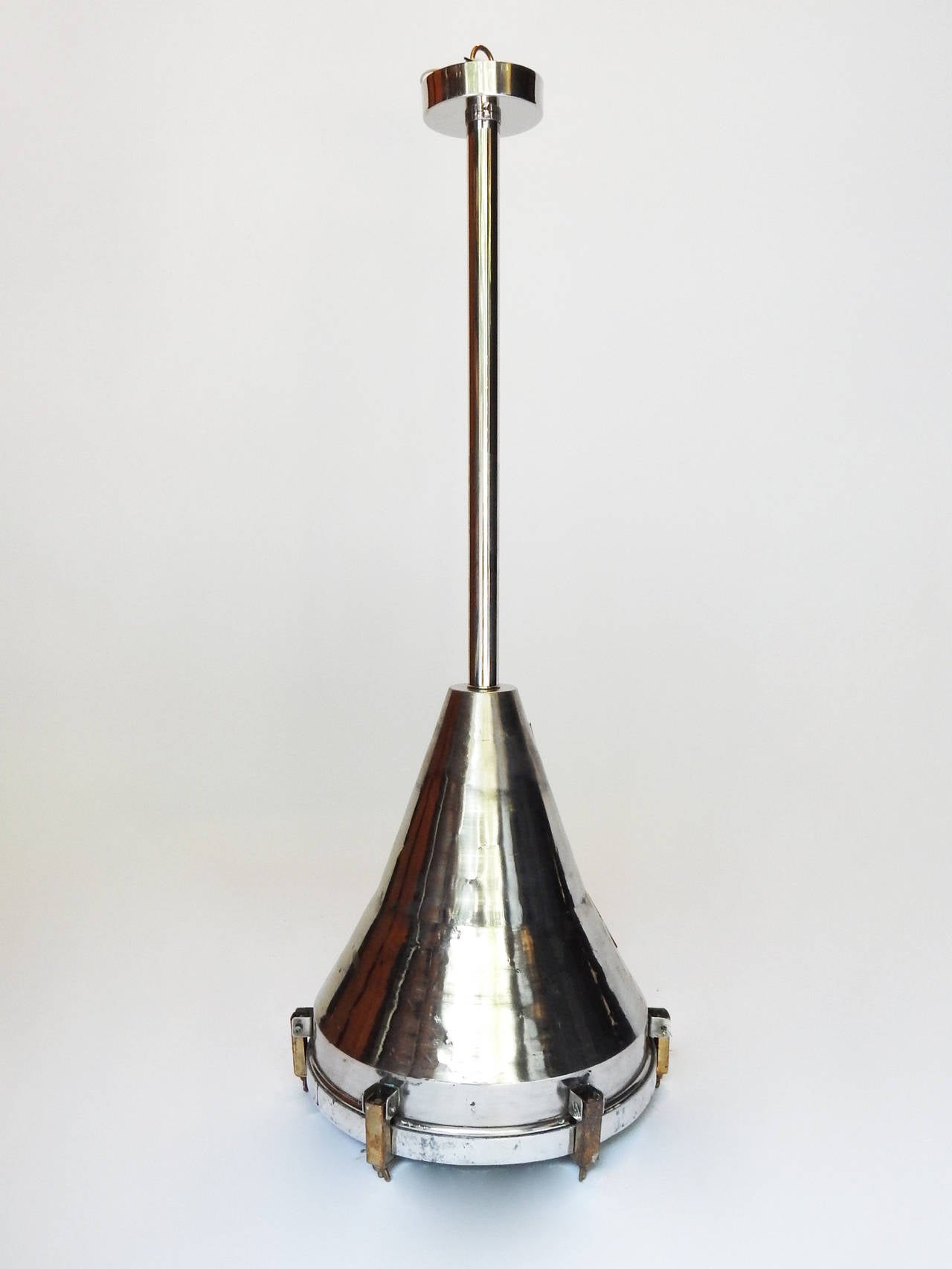 Pair of Industrial chrome lamps with new wiring, stems and canopy.
Height listed includes the length of pole which can be cut (or lengthened) to specifications. Cone only is 22 inches high.
