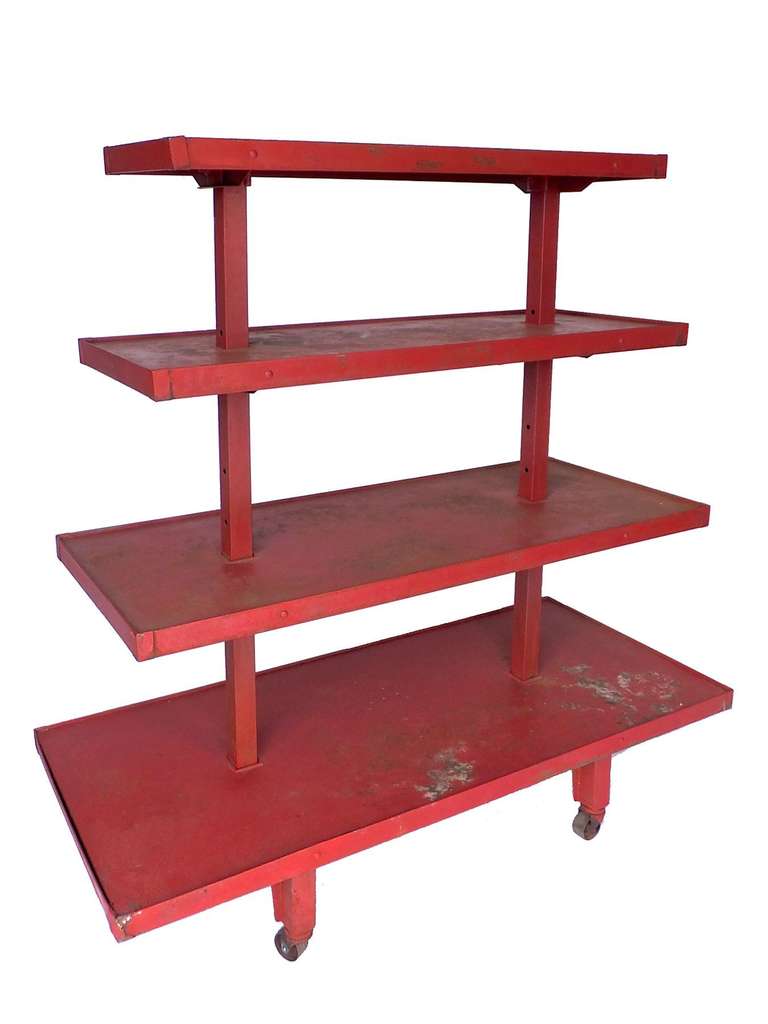 Great industrial shelving unit in original red paint
