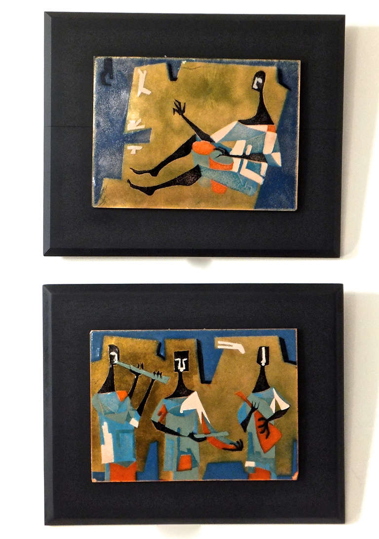 Pair of French enamel plaques of musicians on a gold leafed ground. Mounted on matt black painted wood.