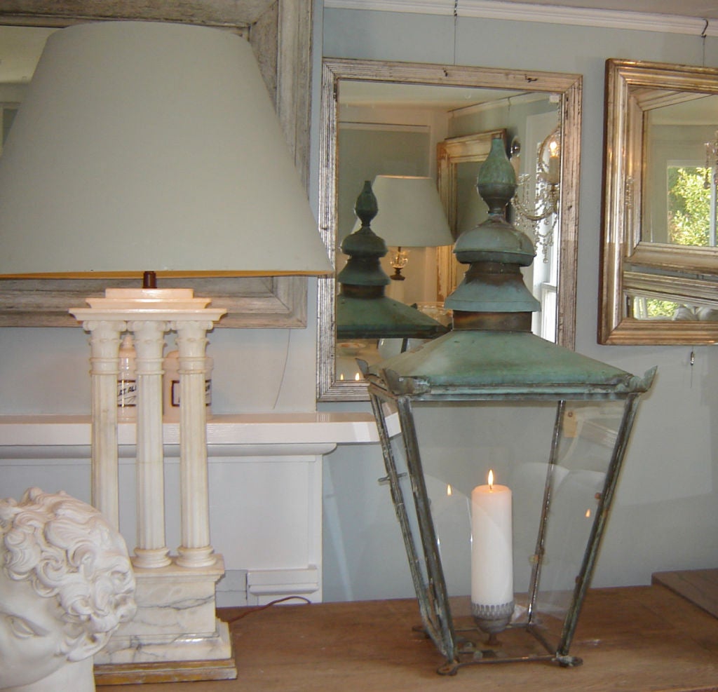 Pair of very large verdigris copper lanterns. Fabulous on a console with candles, as shown, or they can be converted to hanging lanterns for around $300 each.