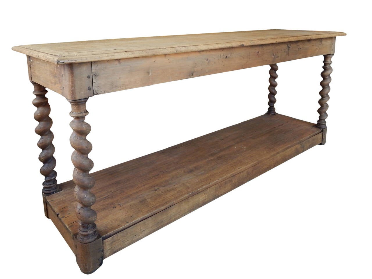 Belgian walnut barley twist drapers table with stripped finish with great age patina.