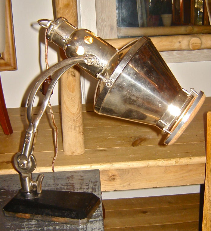 Unusual European spotlight in chrome and bakelite, with a cork ring at the opening. A German friend said it was a medical piece used to warm your ears! Makes a great spotlight or table lamp.