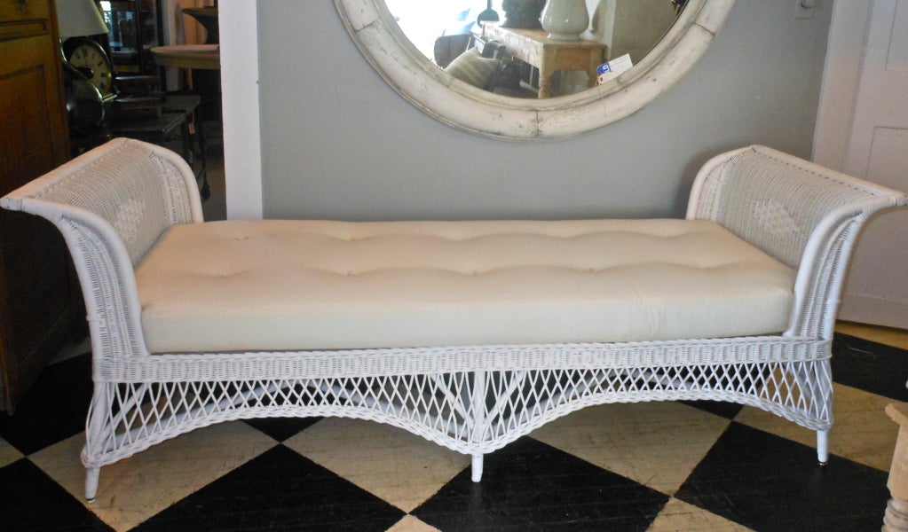 Very fine quality wicker daybed in excellent condition with new muslin covered custom cushion.