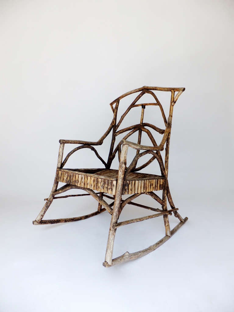 Antique Adirondack twig rocker circa 1910-1920. Sturdy, useable and comfortable. REDUCED FROM $1900