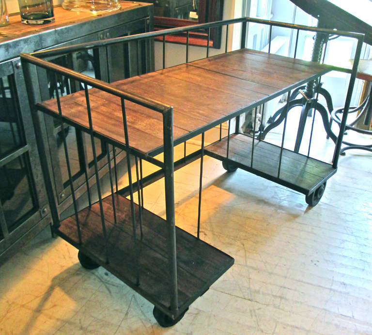 Industrial trolley from Belgium make perfect desks.  Left hand platform is divided by 2 iron bars, measures 27.5
