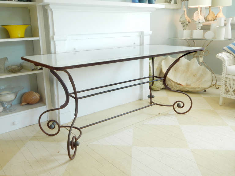 French iron console table base with large milk glass top.
