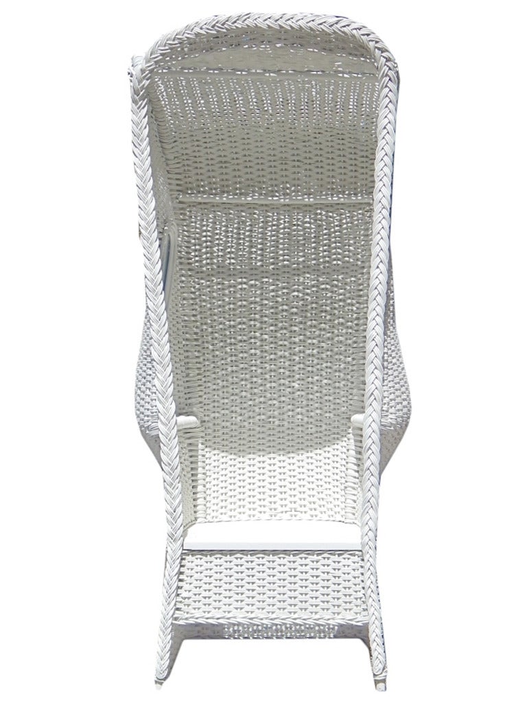 Turn of the century white wicker beach or garden Porter's chair with glass windows and custom cushion covered in muslin. Great for windy spots! Will paint to suit for an additional $250.