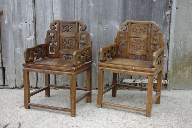 Pair of 19th century Chinese armchairs, with wicker seats.