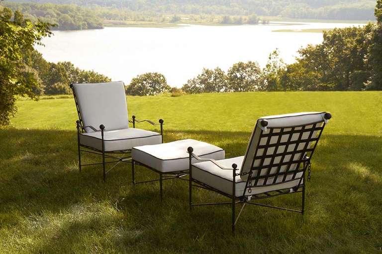 Lounge chair with style. Metal frame in Corsican Black.  Chair in stainless steel - outdoor. Cushions are hand tailored in sumbrella fabric Canvas Natural with black welting. Lead time 4-6 weeks
indoor version available $1493.00