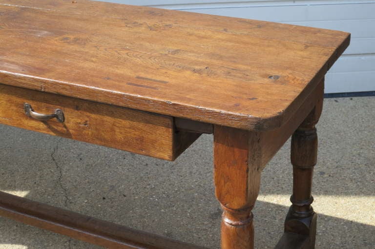 Handsome French Fruitwood work table with two drawers on one side, makes a great server or console table