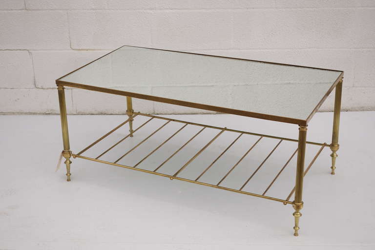 French Cocktail table in Brass, with mirror top. Circa 1930s.