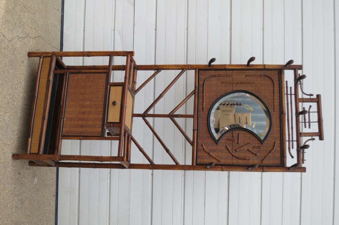 Hall stand for hats with a single drawer. Unusual and characteristic crescent moon mirror.