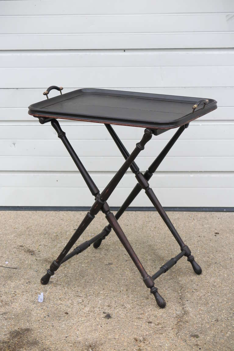 Dual use English butler tray c 1940's with folding stand. Wood with light gold accent on the handles.