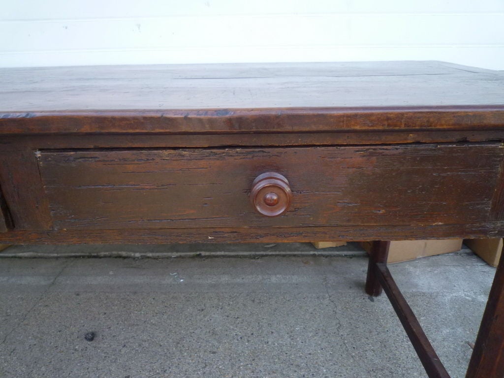 A 19th C rustic server with three drawers. Could be also used as a dining table. Oak base, fruitwood top.