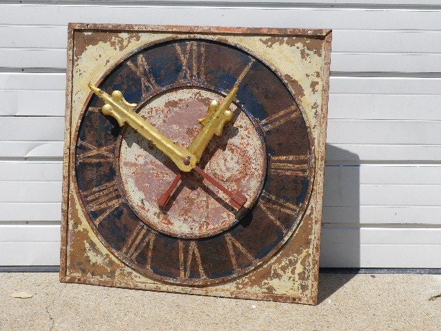 A unique 19th C French Clock face from a tower, in cast iron, with gilded metal hands. All original