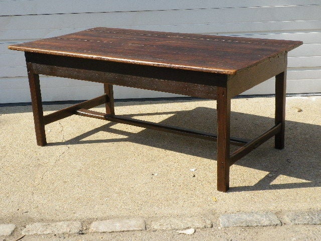 A low French Farmhouse table, now perfect as a coffee table, with stretcher base, stained Elm.