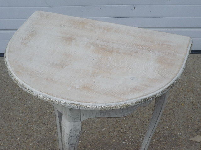 French Louis XV style demi lune table in later white wash paint.