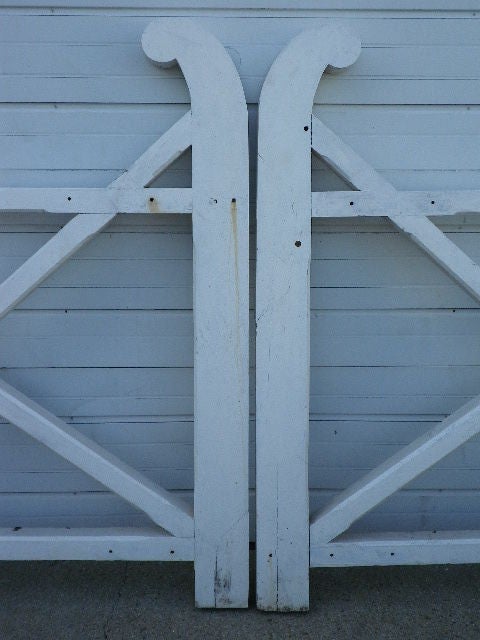 A wonderful large pair of white painted gates.