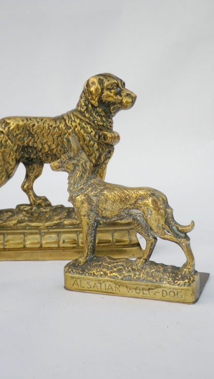 Victorian brass door stops. The large Newfoundland at the rear is $295, and the pair of Alsations are $275, the pair. 
We also have Horse figures.